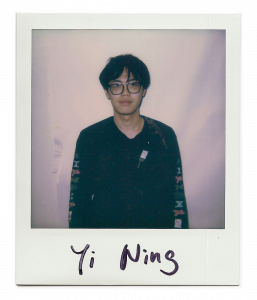Yi, artist standing in front of the camera